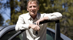 Is keeping my old car greener than buying a new EV man with car keys